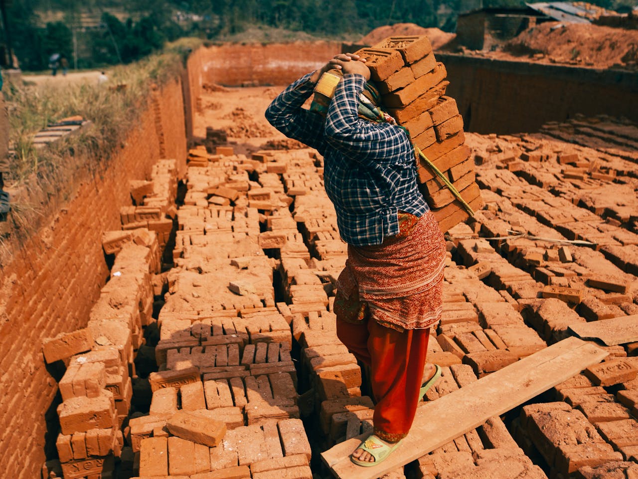 Working Woman Carrying Bricks